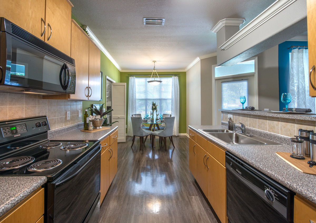 galley-kitchen-with-black-appliances